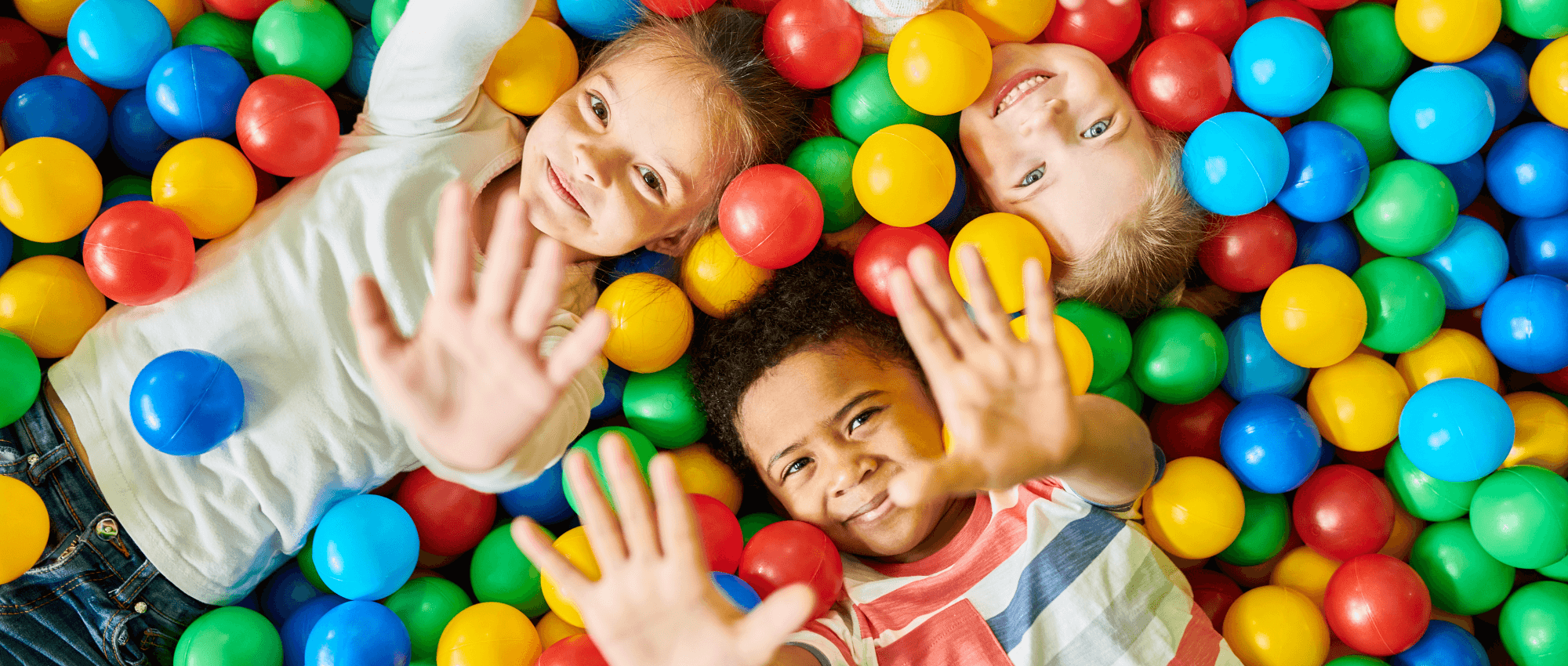 group of kids in a ball pit