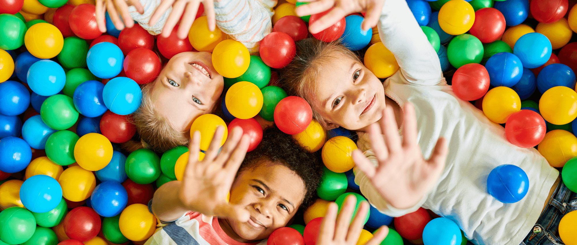 children playing in a ball pit