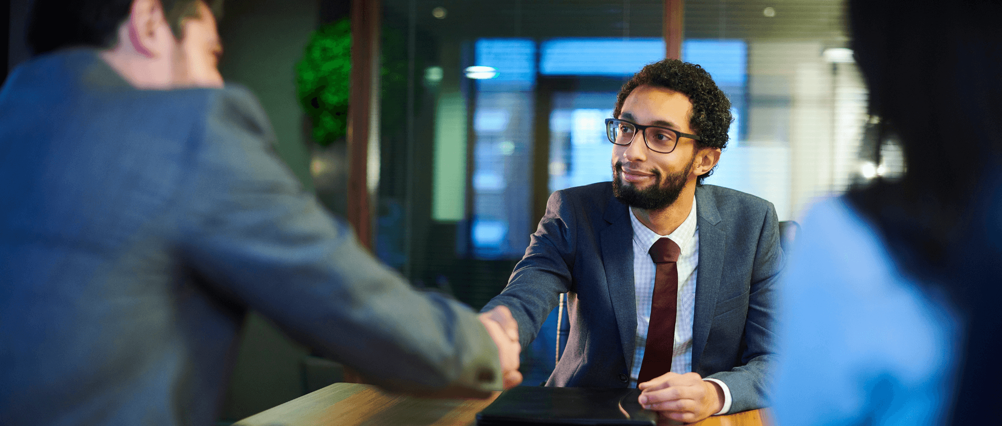 men shaking hands in business meeting