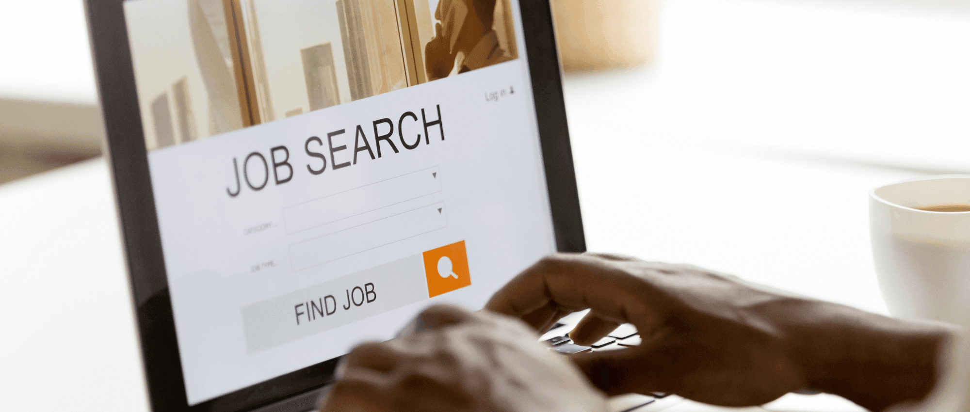 person searching for job on laptop