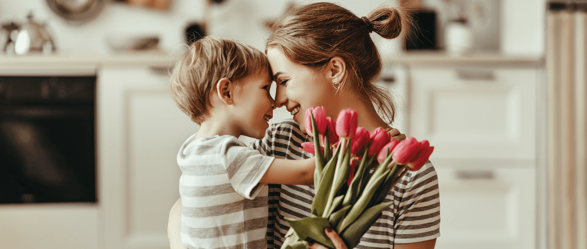 Mom holding flowers with Son