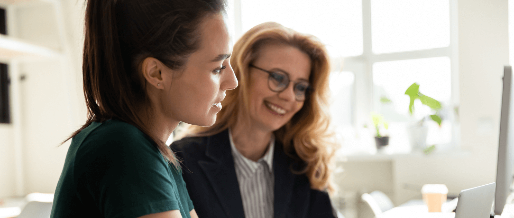 A woman mentoring a youth