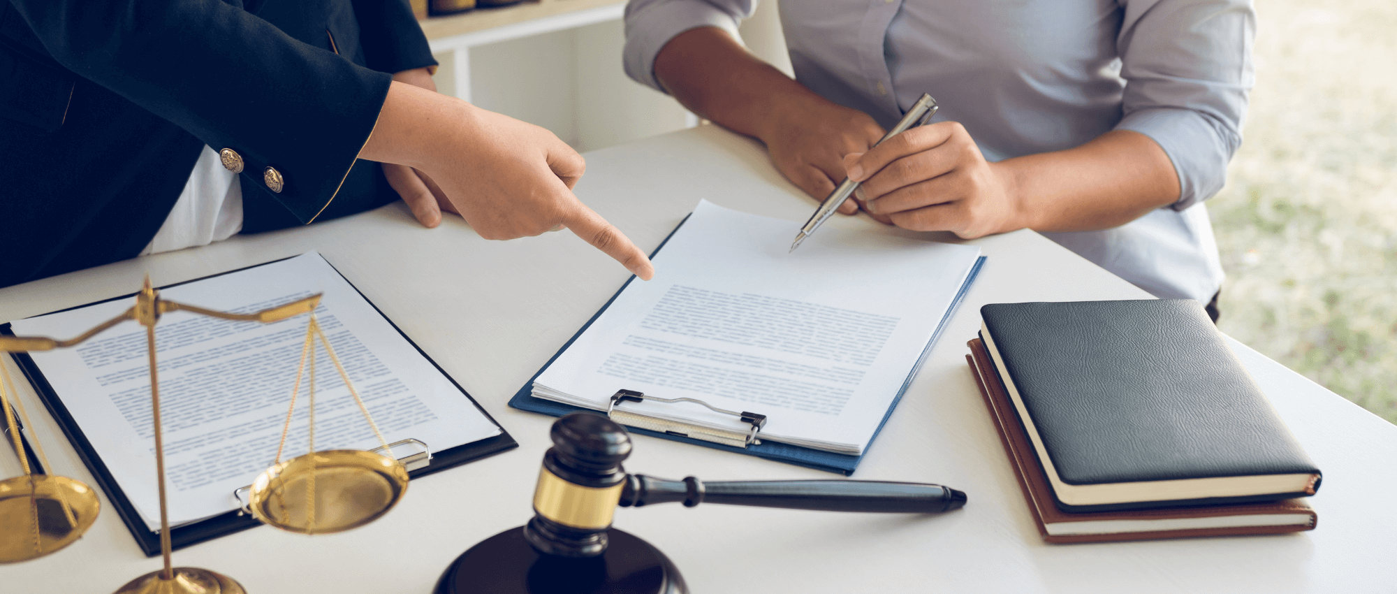 lawyer and client reading document together