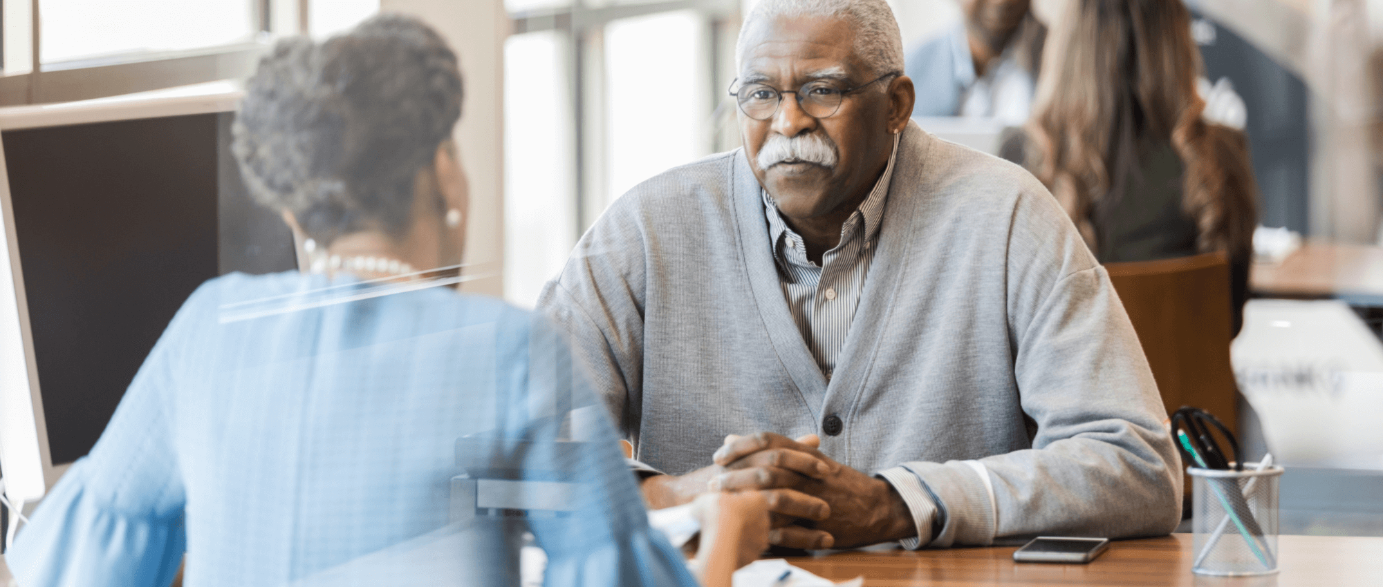 A senior talking to a counsellor
