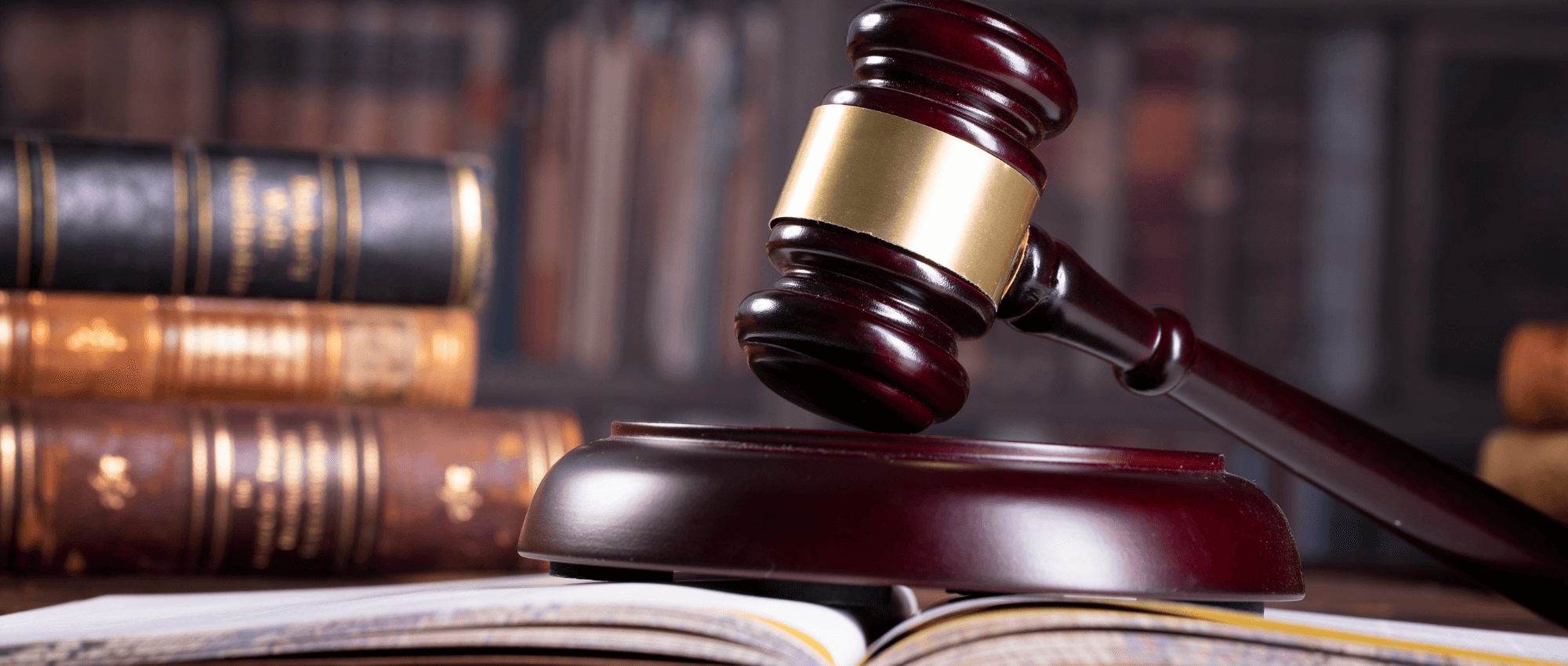 A judge hammer on an open book