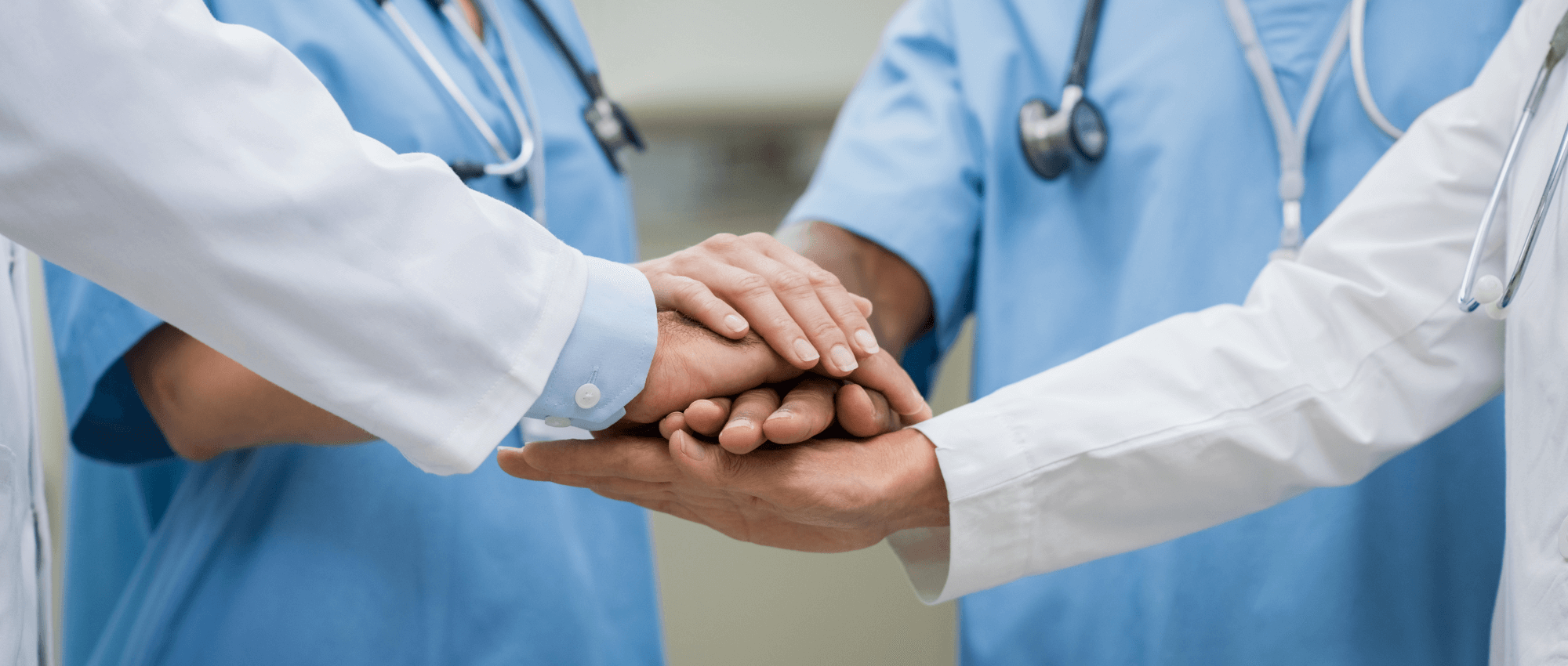 Doctors and Nurses hands on top of each other