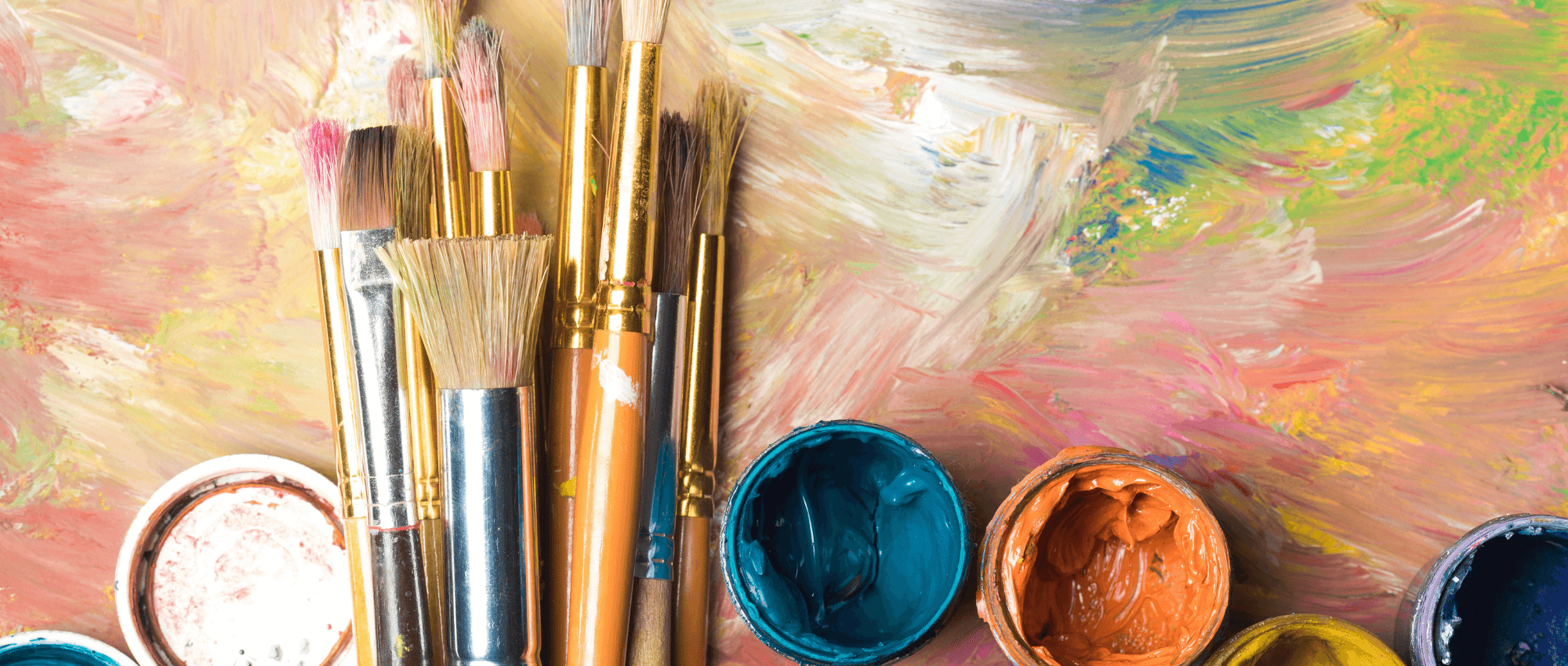 Painting brush with paints on a painting picture