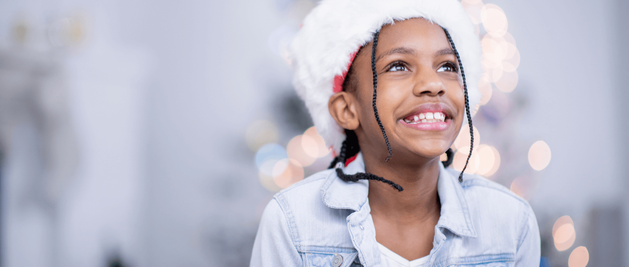 A girl smiling and wearing a winter hat