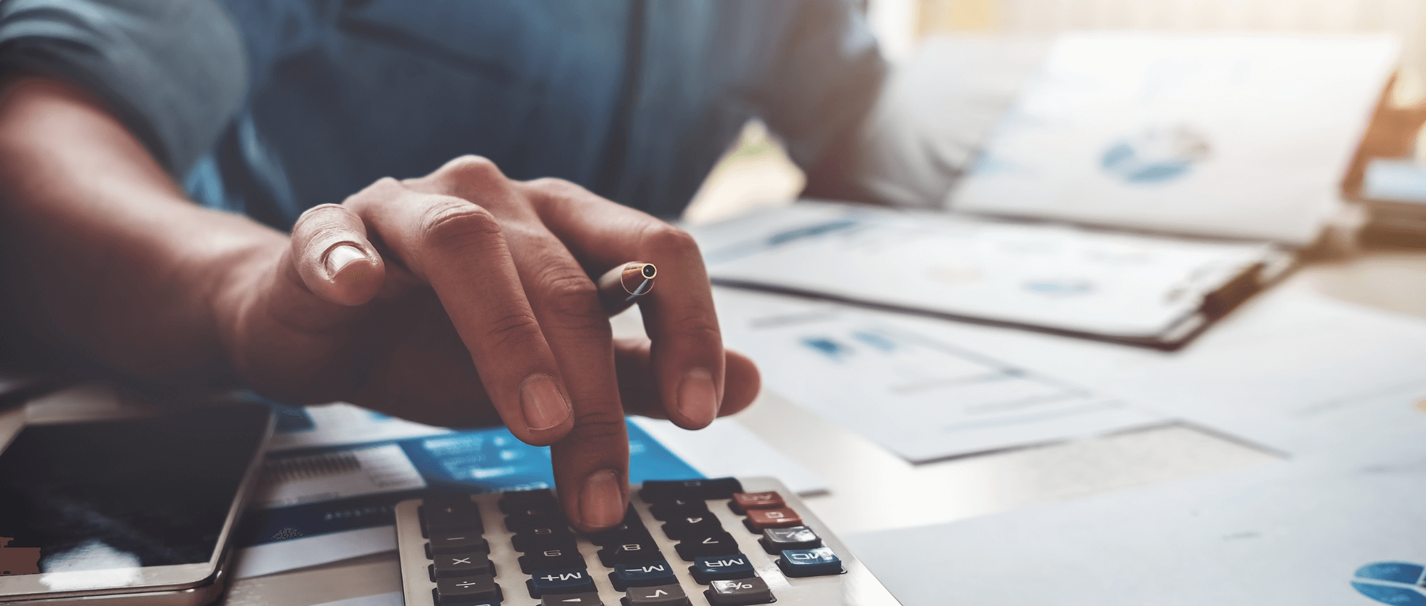 An accountant calculating something using a calculator