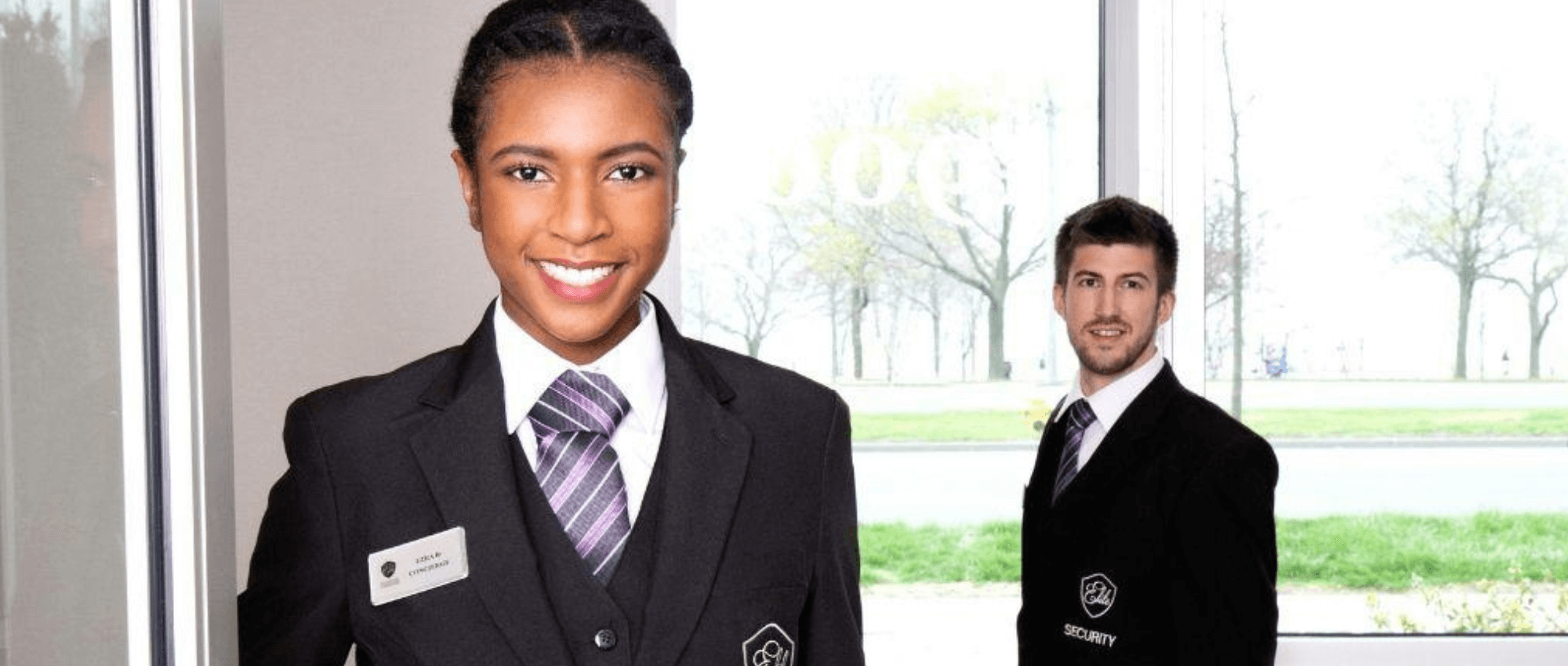 Two security staff smiling