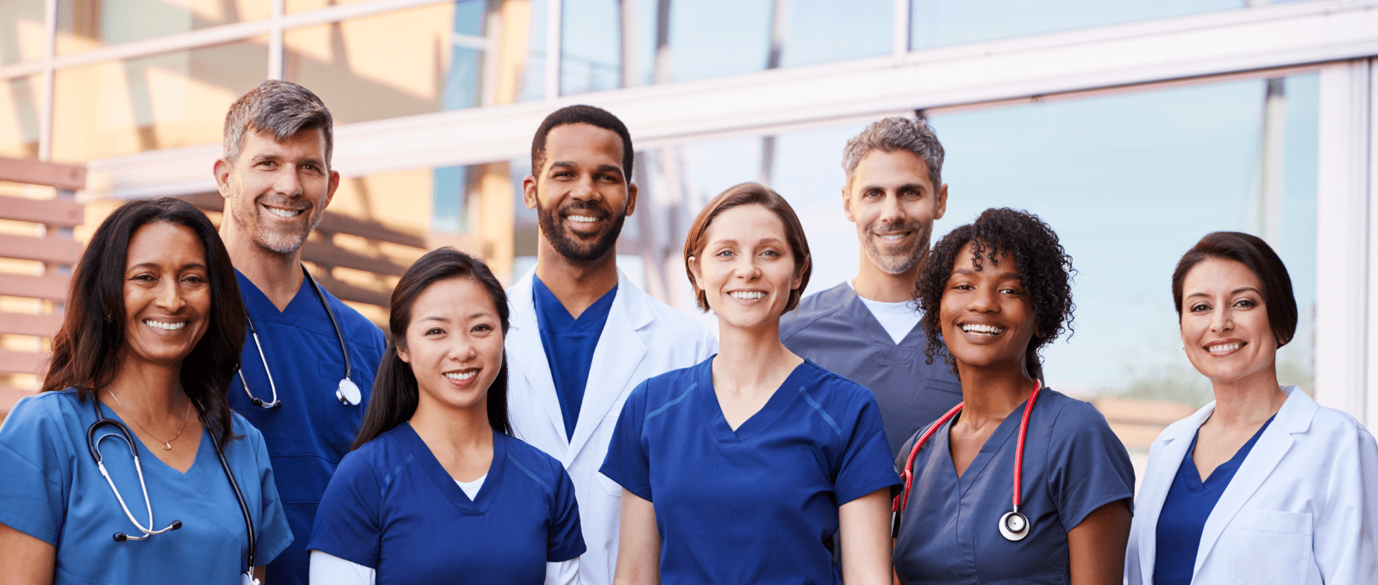 Doctors and Nurses smiling to the camera
