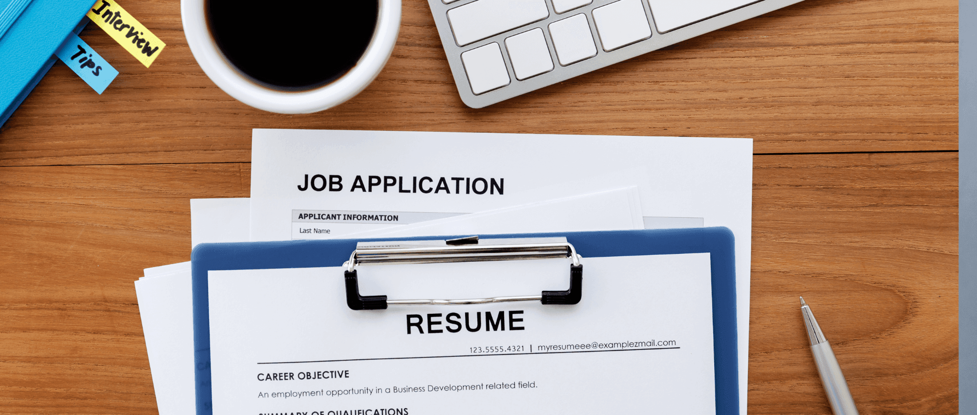 Resume and Job application template on a staff wooden table