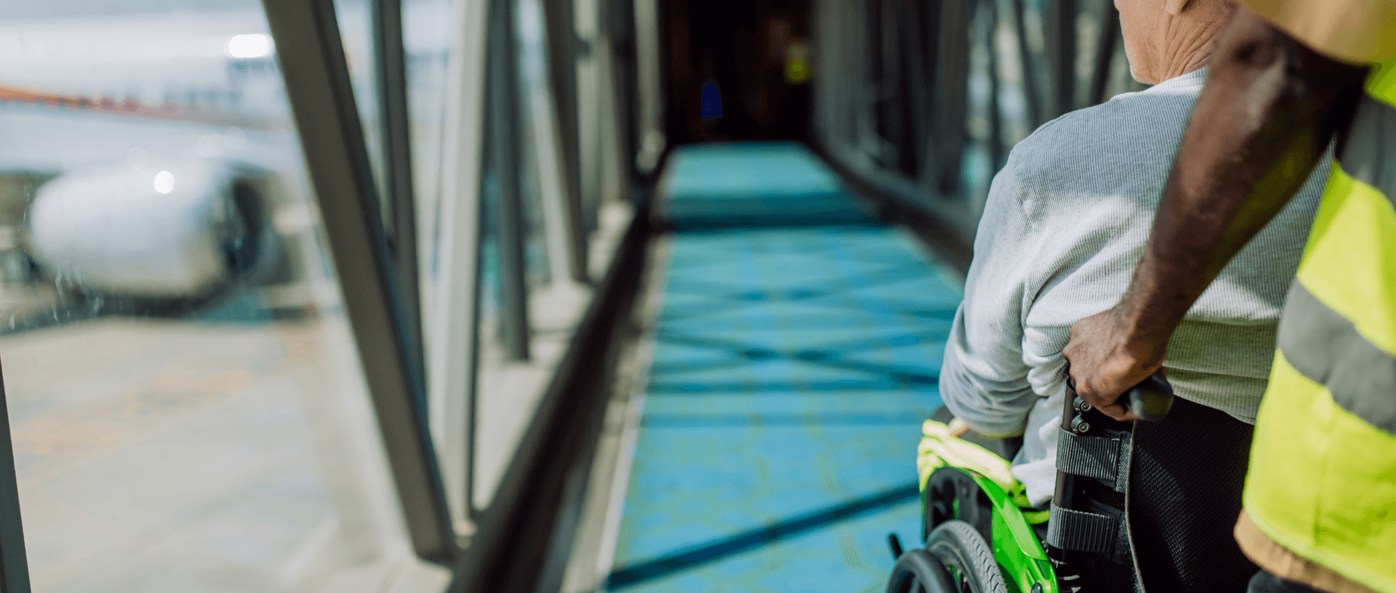 A person helping a disabled person on a wheelchair