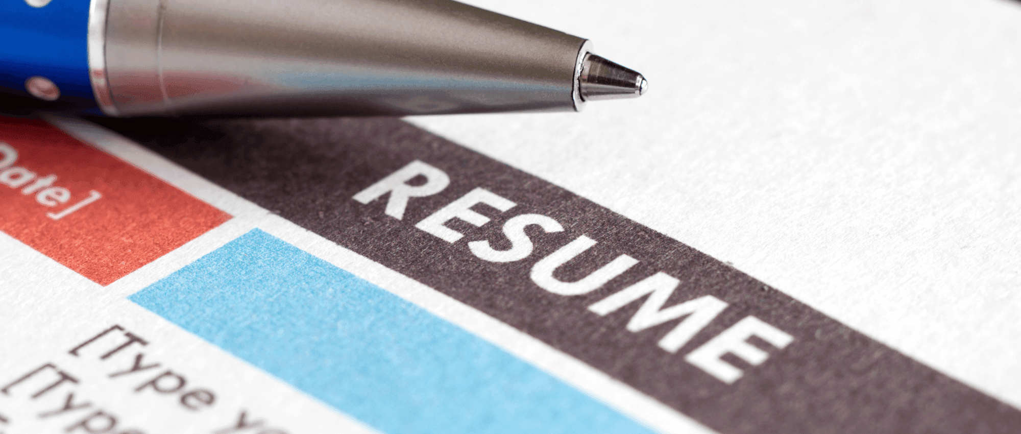 A pen on top of a resume