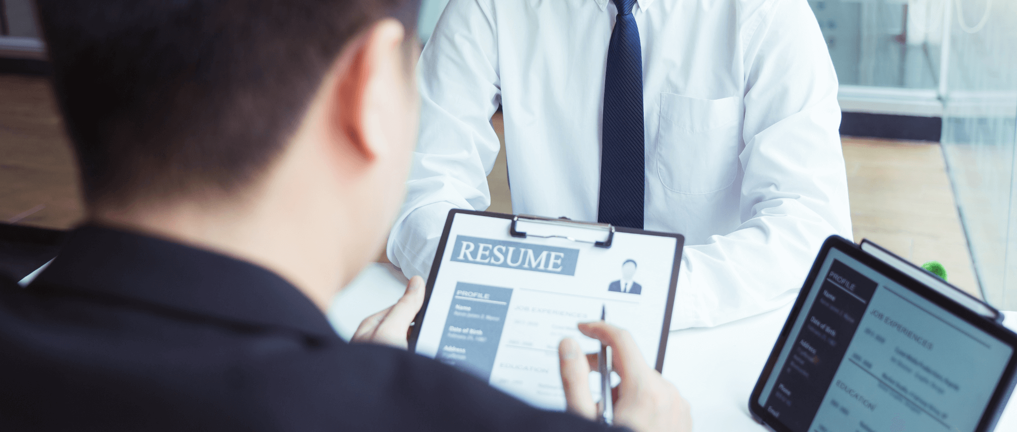 A person looking over a resume
