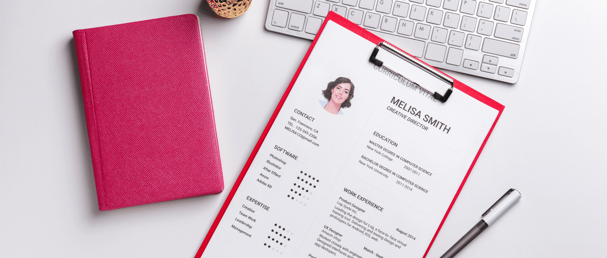 A person's resume on a clipboard