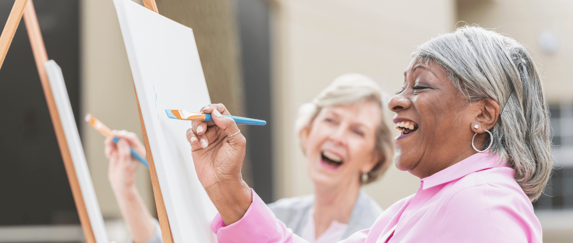 Two seniors painting