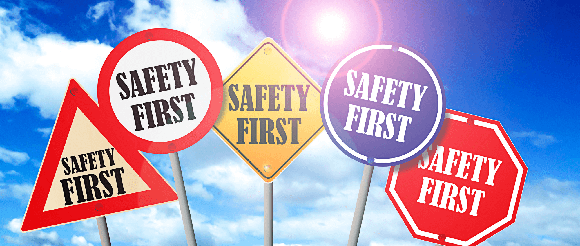 A sky with stop signs with Safety First words