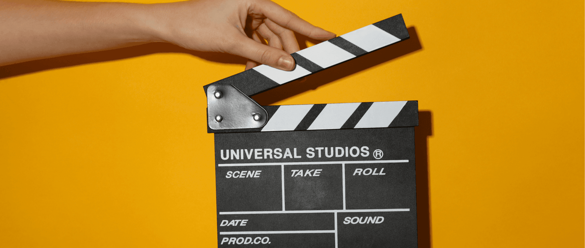 A person holding the cinema clapper board